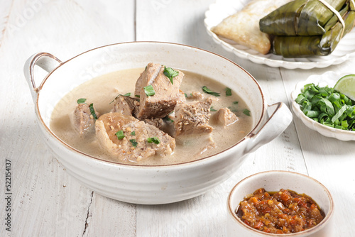 Coto Makasar is Indonesian traditional food from Makasar, Sulawesi, served with Buras. photo