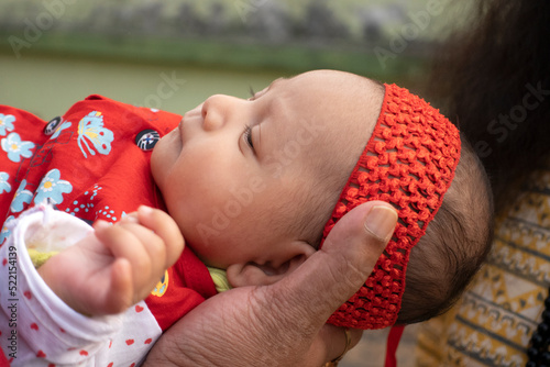 Close up portrait of a cute indian baby at outdoors