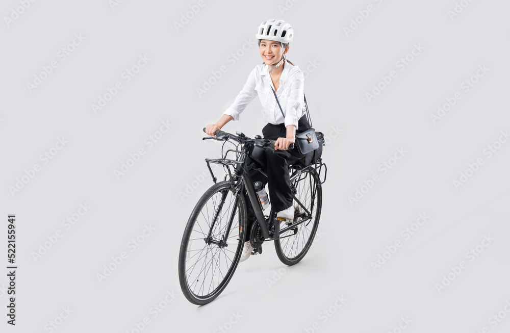 Asian beautiful woman, she is riding a city bike to work.She is greeting.studio concept Asian beautiful woman, she is riding a city bike to work.She is greeting.studio concept
