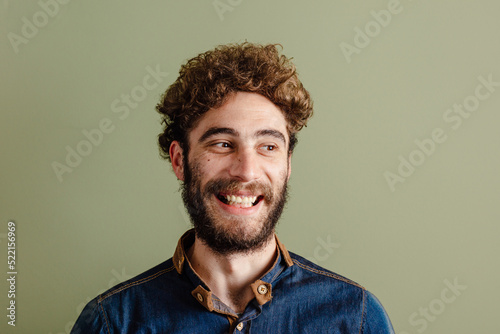 Happy man with curly hair portrait photo