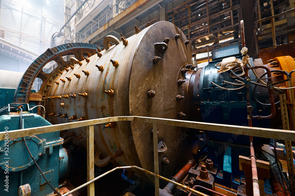 Ball mill grinds ore at mining and concentrating plant - obrazy, fototapety, plakaty 