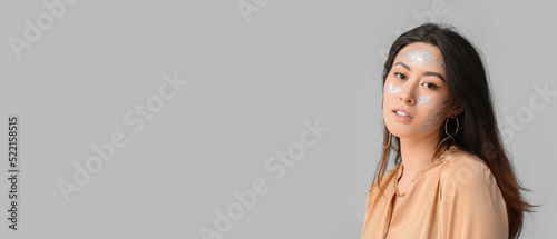 Elegant Asian woman with gl...