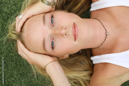 young woman relaxing on grass