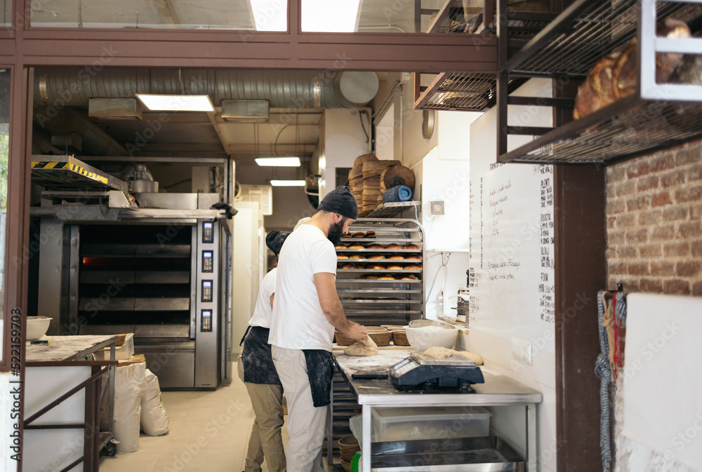 Bread Maker Kneading Dough In Bakery Bread Maker Kneading Dough In Bakery