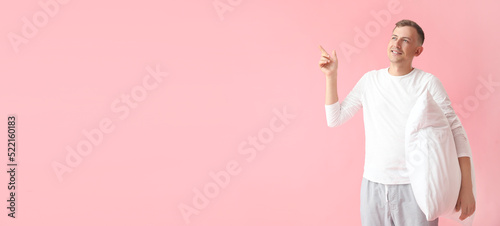 Young man in pajamas and wi...