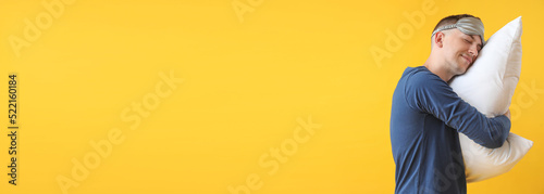 Sleepy young man in pajamas...