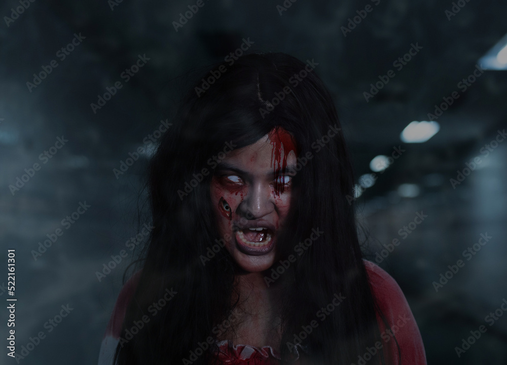 Three eyes Girl ghost woman death with blood the horror is screaming darkness and nightmare dark background, Scary fear on hell is monster devil  in halloween festival.