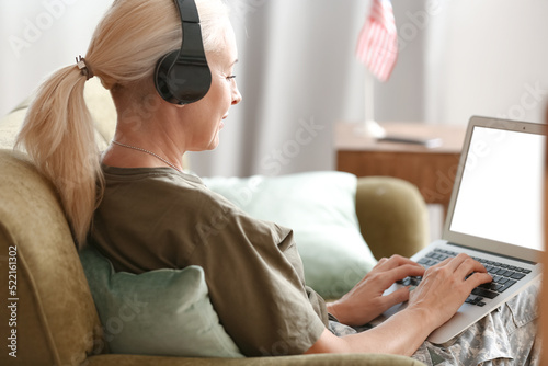 Mature female soldier in he...