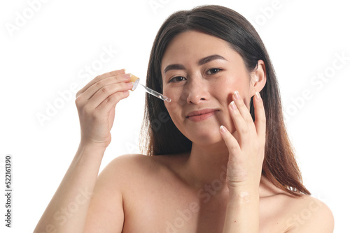 Young Asian woman with cosm...