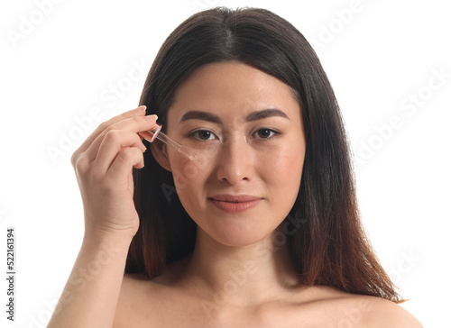 Young Asian woman with cosm...
