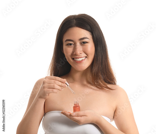 Young Asian woman with cosm...