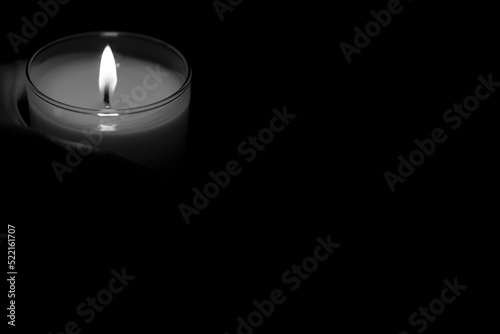The concept of mourn, Candle dark on black background, RIP, Black and white photo