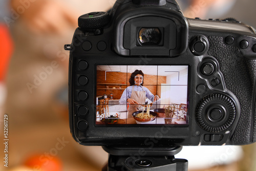 Young woman cooking pasta o...