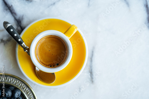 Cup of espresso on marble table