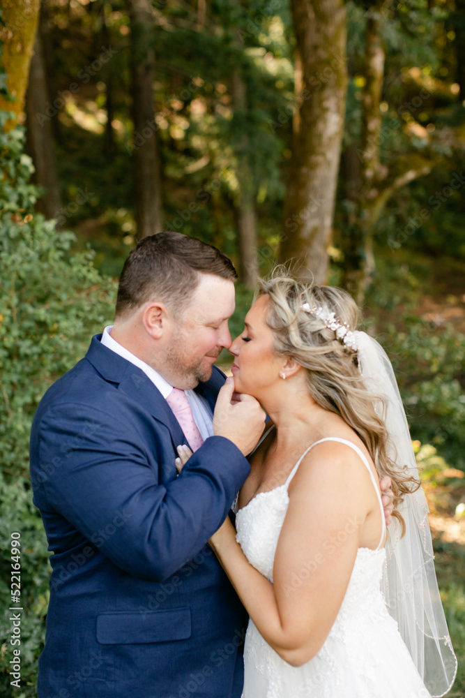Romantic Moment Between Bride and Groom in the Woods Romantic Moment Between Bride and Groom in the Woods