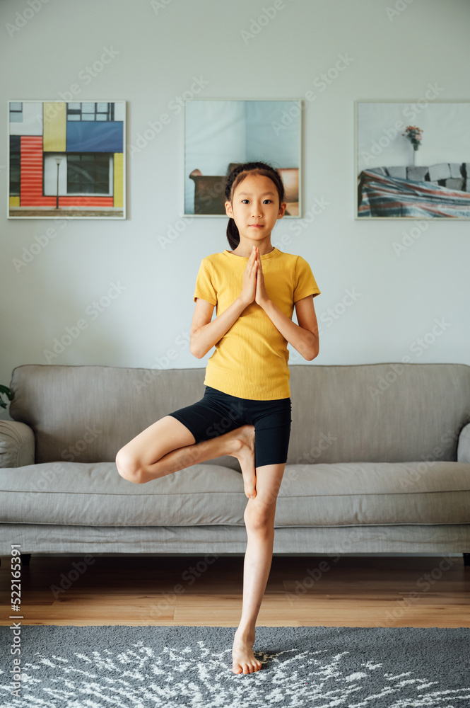 Cute girl doing yoga at home Cute girl doing yoga at home