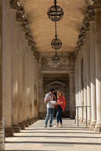 Two Gen Z Friends University Students review assignment on campus photo