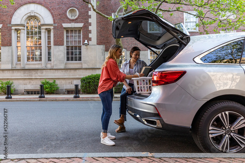 Mother and Daughter Moving in to college dorm room together 