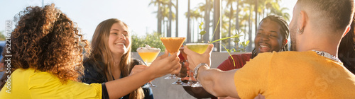 Canvas Print Happy group of friends having fun and toasting with cocktails