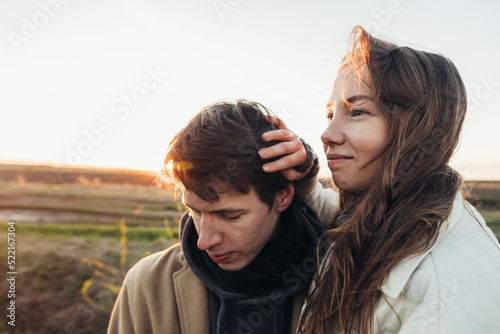 Young spouses at sunset photo