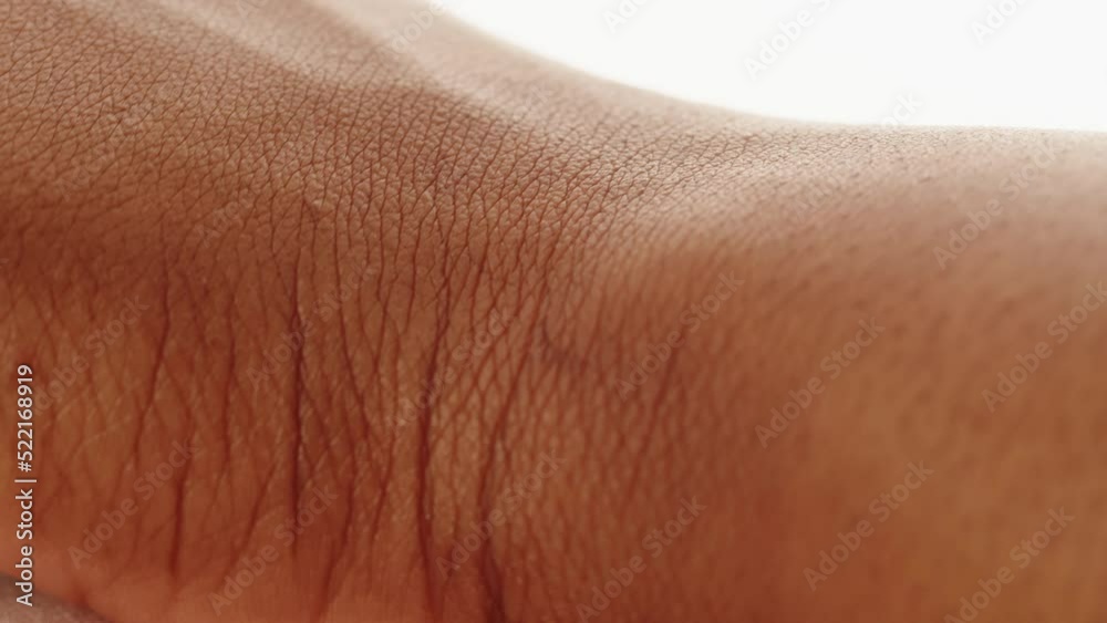 Black skin texture close-up. Native African American woman, hand surface macro shooting. Body and healthcare, hygiene and medicine concept.