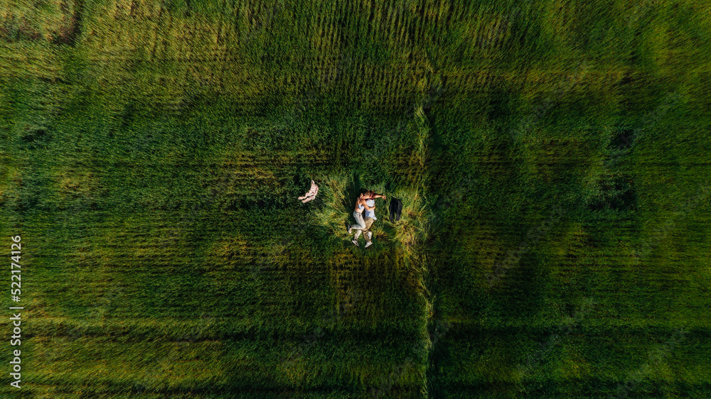 true lovers in the grass, hugging and kissing true lovers in the grass, hugging and kissing