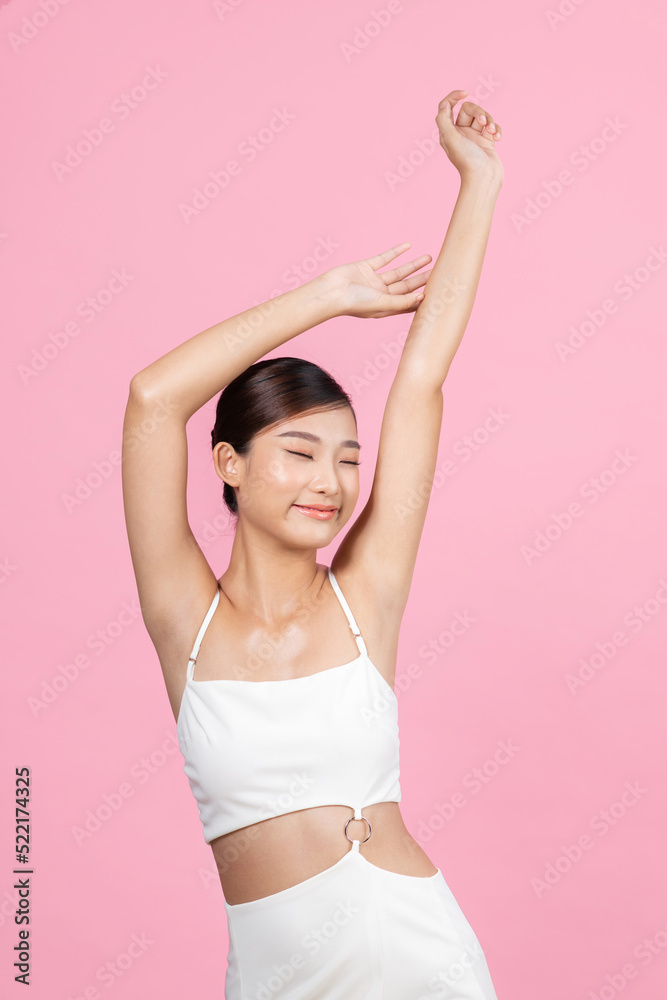Beautiful young Asian woman holding her arms up Beautiful young Asian woman holding her arms up
