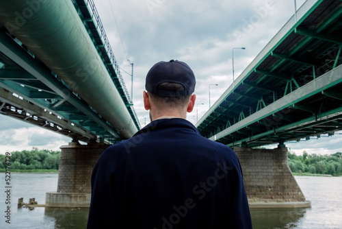 A guy under a bridge photo