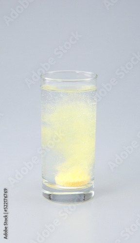 Vitamin C with B complex , Calcium , Magnesium Tablet dissolved in a glass of water.