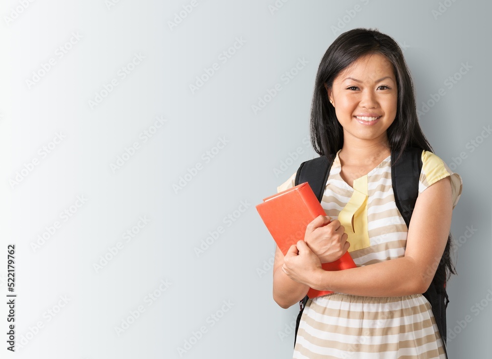 Happy high school student beautiful girl show a book Happy high school student beautiful girl show a book