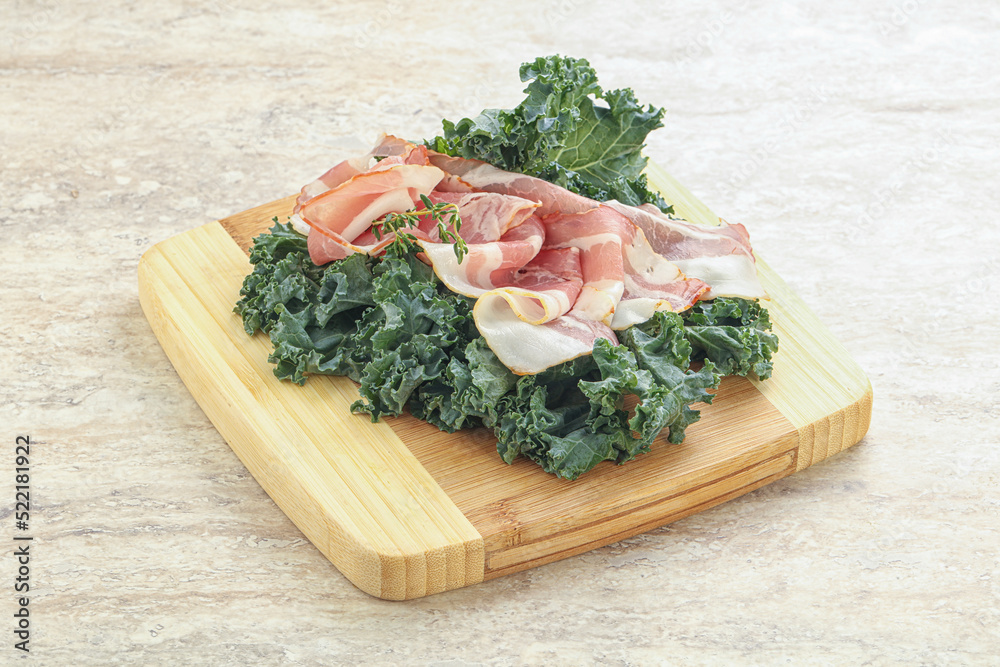 Raw pork bacon over board Raw pork bacon over board