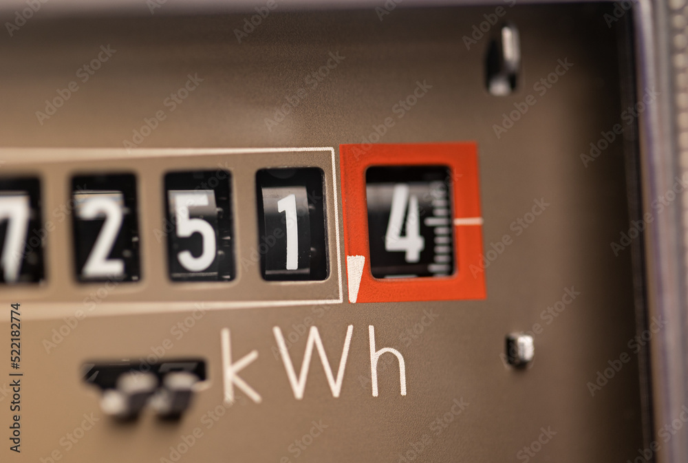 Close-up electricity meter. Analog electricity meter for households. Measuring used electricity in kWh ( kilowatt hour ) Close-up electricity meter. Analog electricity meter for households. Measuring used electricity in kWh ( kilowatt hour )