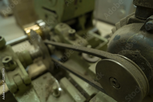 Electric motor drive belt on old industrial equipment. Belt drive. Selective focus