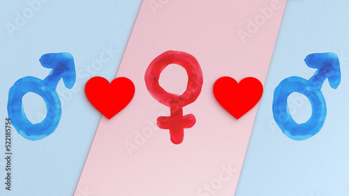 Polyamory concept. Two blue male gender symbols, one red female gender symbol & hearts. Concept illustration of polyamorous (consensual nonmonogamy) relationship. Textured blue & pink paper background photo