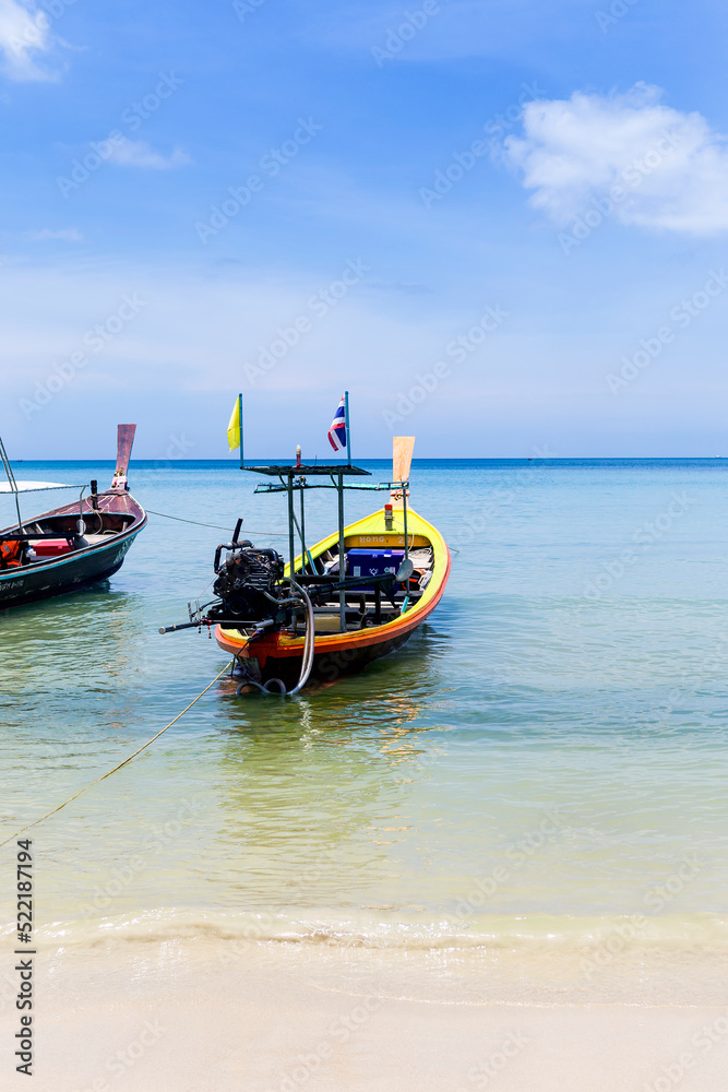 Thai style wooden boat at the beach in south of Thailand, tourist industry, transportation by boat, travel to island by boat