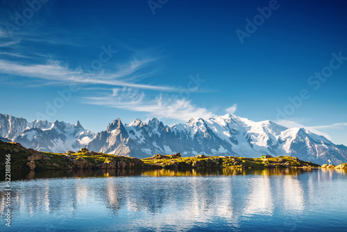 Gorgeous scene of high alpine lake Lac Blanc and Mont Blanc glacier. Chamonix resort, Graian Alps, France, Europe.