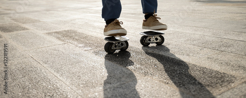 Freeline skateboarder legs skateboarding at city photo