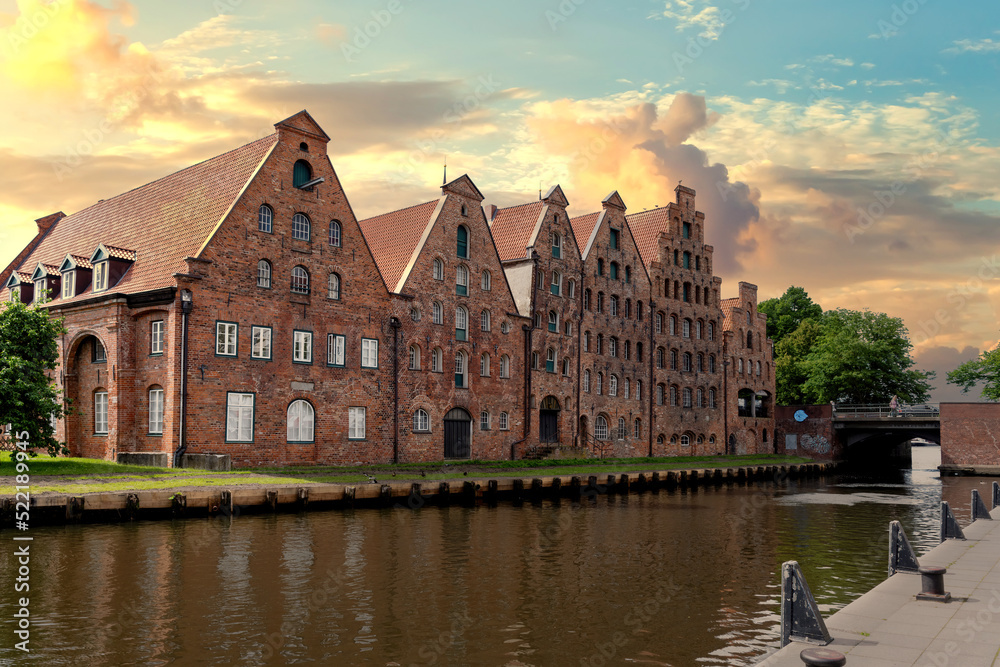 Trave shore with Salt storage at sunset in Lübeck, Germany