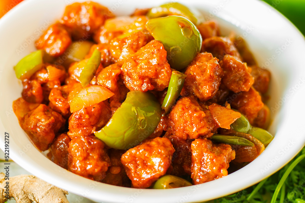 selective focus of Soya Manchurian/Chili Soya bean chunks recipe. with a decorative background. selective focus of Soya Manchurian/Chili Soya bean chunks recipe. with a decorative background.