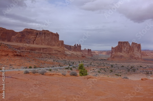 Photo of La Sal Mountains Viewpoint showing The Organ, Tower of Babel, Sheep Rock and Three Gossips in Arches National Park in Moab, Utah, United States in works project administration style.