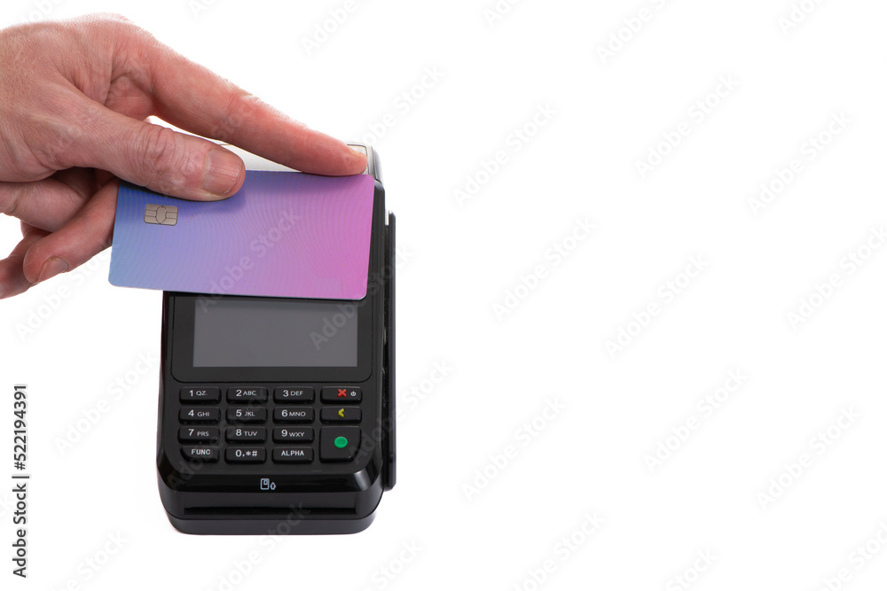 Attached plastic card to the payment terminal with a man's hand on a white isolated background, copy space Attached plastic card to the payment terminal with a man's hand on a white isolated background, copy space