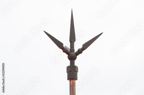 Trident lightning rod on building, on white background