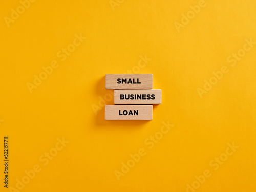 The word small business loan on wooden blocks. Business and finance photo