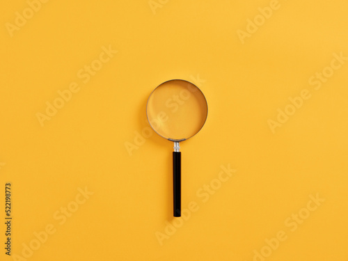 Magnifying glass or magnifier on yellow background