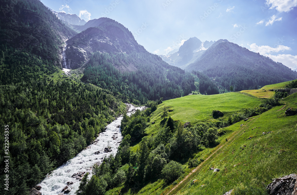 Travel by Switzerland. Beautifl summer landscape. River in Alps Mountains.