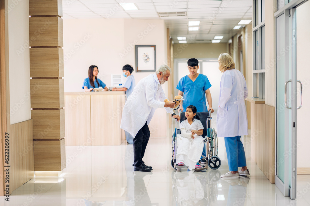 Group of professional medical doctor team work with stethoscope in uniform working discussing and talk with sick patient walking in hospital.health medical care concept