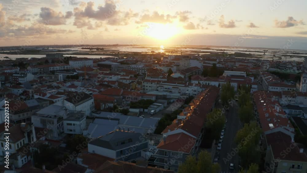 Aerial view over the cityscape of Aveiro, sunset in Portugal - tilt, drone shot Aerial view over the cityscape of Aveiro, sunset in Portugal - tilt, drone shot