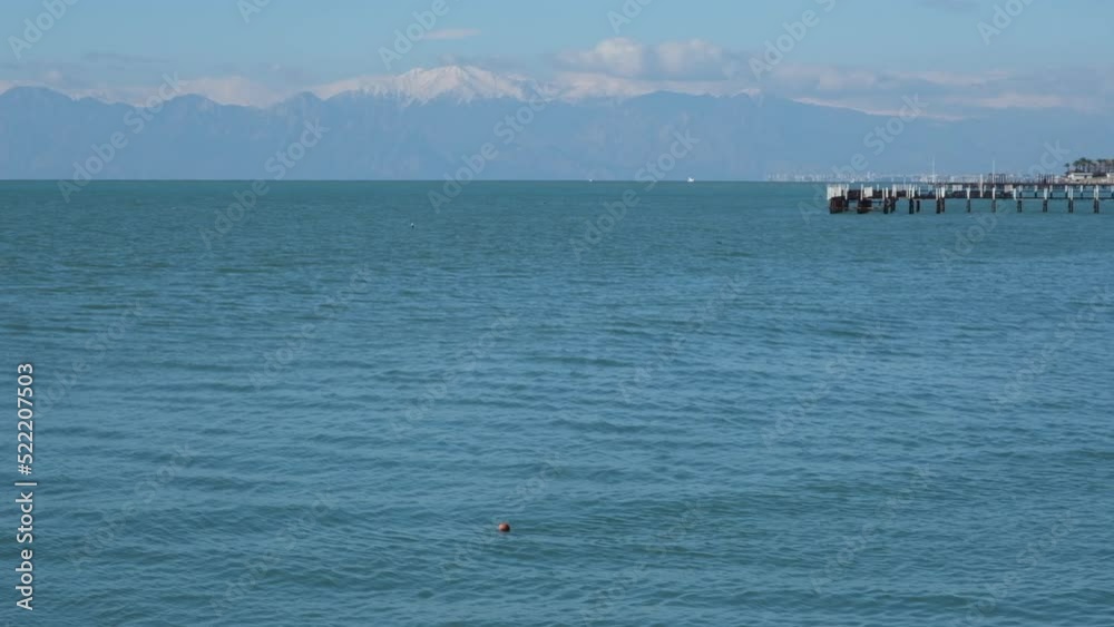 The Mediterranean Sea against the backdrop of snow-capped mountains in the village of Kundu Lara Antalya Turkey The Mediterranean Sea against the backdrop of snow-capped mountains in the village of Kundu Lara Antalya Turkey