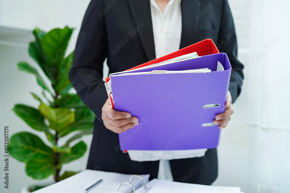 Business woman busy working with documents in office. Business woman busy working with documents in office.