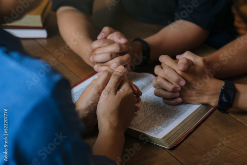 Christian Bible Study Concepts. Group of Christian read and study the bible together in a home. followers are studying the word of God and worship in church..